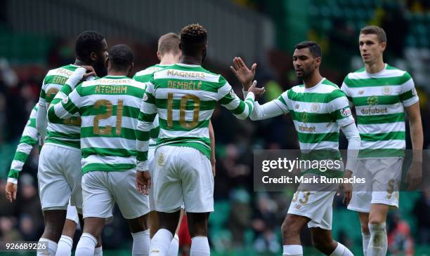 Moussa Dembele of Celtic celebrates scoring his second goal of the game with his team mates during the Scottish Cup Quarter Final match between...