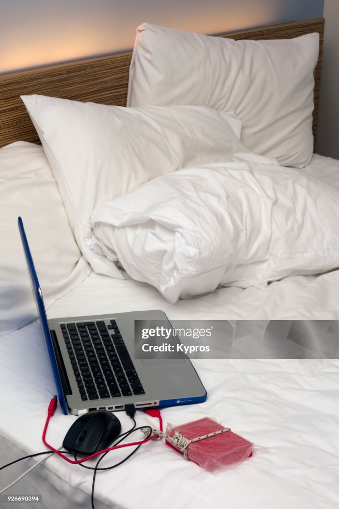 View Of Laptop Computer In Bedroom