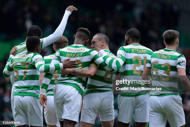 Moussa Dembele of Celtic celebrates scoring his second goal of the game with his team mates during the Scottish Cup Quarter Final match between...