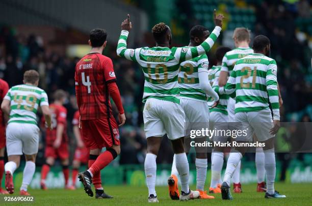 Moussa Dembele of Celtic celebrates scoring his second goal of the game with his team mates during the Scottish Cup Quarter Final match between...