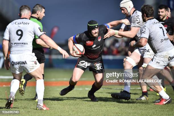 Lyon's Australian number 8 Liam Gill vies with Toulon's Fiji wing Semi Radradra during the French Top 14 rugby union match between Lyon and Toulon on...