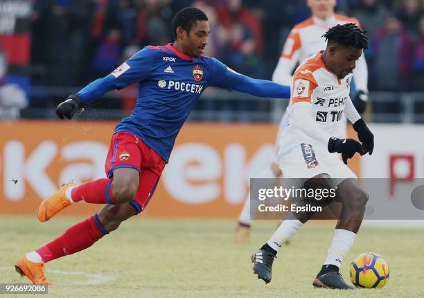 Vitinho of PFC CSKA Moscow vies for the ball with Petras Bumal of FC Ural Ekaterinburg during the Russian Premier League match between PFC CSKA...