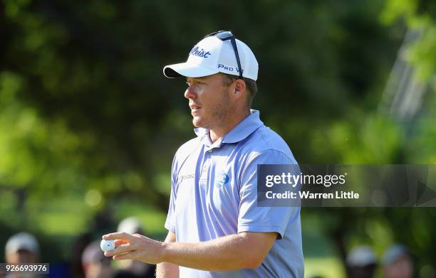 George Coetzee of South Africa acknowledges the crowd on the 18th green during the third round of the Tshwane Open at Pretoria Country Club on March...