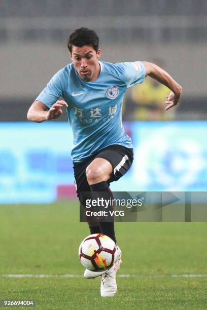 Nicolas Gaitan of Dalian Yifang drives the ball during the 2018 Chinese Football Association Super League first round match between Shanghai SIPG and...