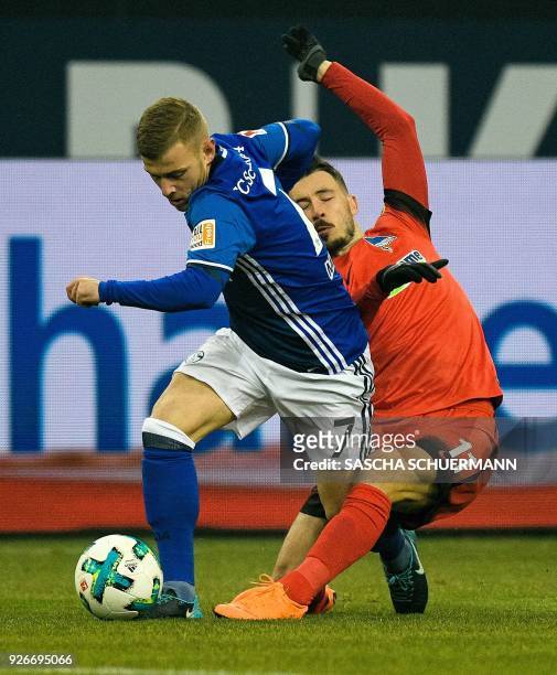Schalke's German midfielder Max Meyer and Berlin's Australian midfielder Mathew Leckie vie for the ball during the German first division Bundesliga...