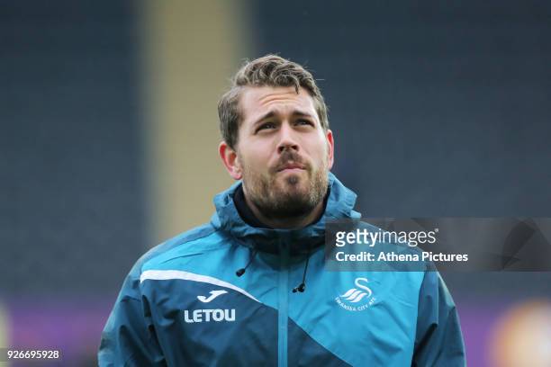 Kristoffer Nordfeldt of Swansea City warms up prior to the Premier League match between Swansea City and West Ham United at The Liberty Stadium on...
