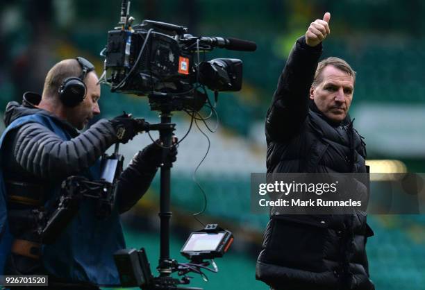 Celtic manager Brendan Rodgers waves to the crowd at the final whistle as Celtic win 3-0 during the Scottish Cup Quarter Final match between Celtic...