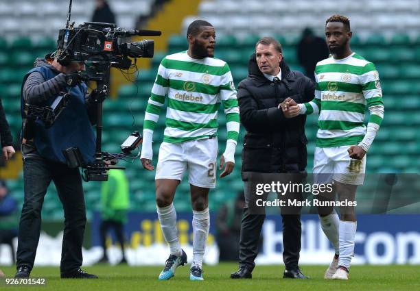 Celtic manager Brendan Rodgers congratulates goal scorer Moussa Dembele at the final whistle after his two goals during the Scottish Cup Quarter...