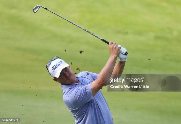 George Coetzee of South Africa plays his second shot into the 15th green during the third round of the Tshwane Open at Pretoria Country Club on March...