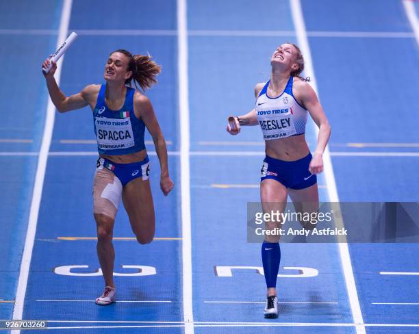 Maria Enrica Spacca from Italy and Meghan Beesley of Great Britain during Round 1 of the Womens 4x400m Relay on Day 3 of the IAAF World Indoor...