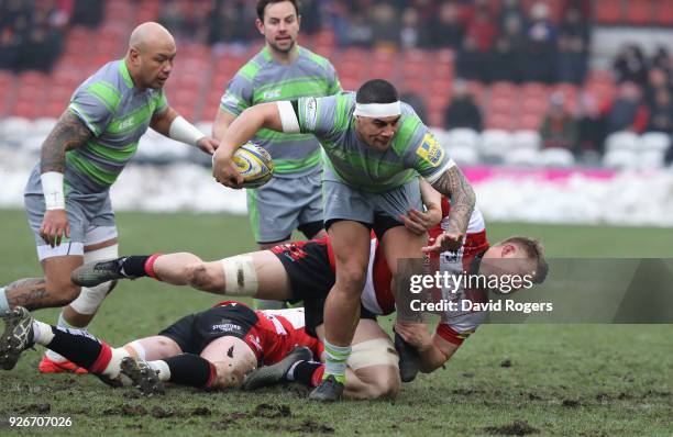 Josh Matavesi of Newcastle is moves past Freddie Clarke during the Aviva Premiership match between Gloucester Rugby and Newcastle Falcons at...