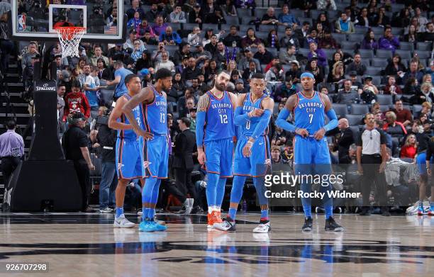 Josh Huestis, Paul George, Steven Adams, Russell Westbrook and Carmelo Anthony of the Oklahoma City Thunder face the Sacramento Kings on February 22,...