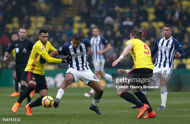 Jose Salomon Rondon of West Bromwich Albion is challenged by Etienne Capoue of Watford during the Premier League match between Watford and West...
