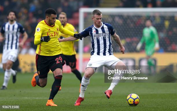 Etienne Capoue of Watford and Chris Brunt of West Bromwich Albion battle for the ball during the Premier League match between Watford and West...