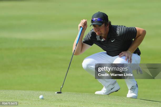 Sam Horsfield of England lines upa putt on the 18th green during the third round of the Tshwane Open at Pretoria Country Club on March 3, 2018 in...