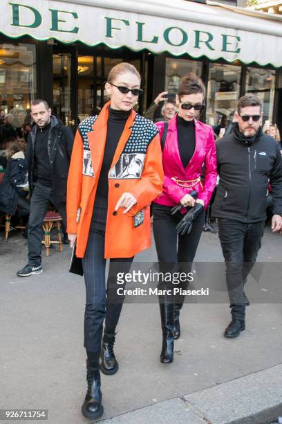 Models Gigi Hadid and Bella Hadid are seen leaving the 'Cafe de Flore' on March 3, 2018 in Paris, France.