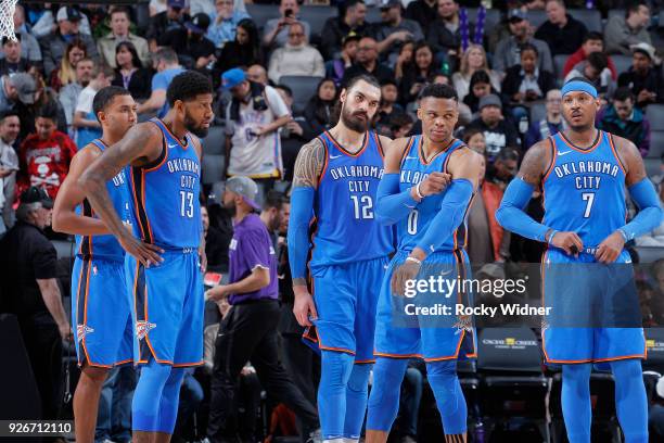 Josh Huestis, Paul George, Steven Adams, Russell Westbrook and Carmelo Anthony of the Oklahoma City Thunder face the Sacramento Kings on February 22,...