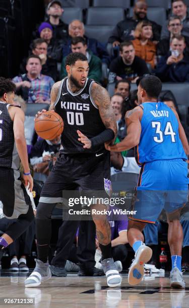 Willie Cauley-Stein of the Sacramento Kings handles the ball against Josh Huestis of the Oklahoma City Thunder on February 22, 2018 at Golden 1...