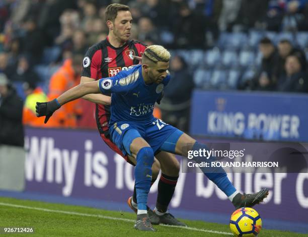 Leicester City's Algerian midfielder Riyad Mahrez vies with Bournemouth's English midfielder Dan Gosling during the English Premier League football...
