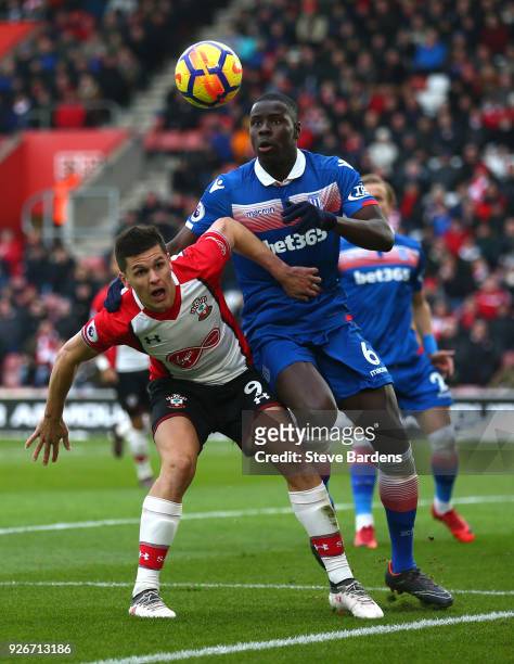 Guido Carrillo of Southampton battles for possesion with Kurt Zouma of Stoke City during the Premier League match between Southampton and Stoke City...