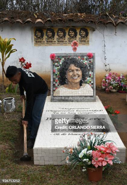 Man cleans indigenous environmentalist Berta Caceres grave in La Esperanza, Honduras, on March 3, 2018. Relatives and indigenous people demanded...