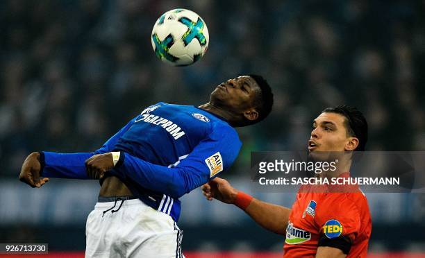Schalke's Swiss forward Breel Embolo and Berlin's Dutch defender Karim Rekik vie for the ball during the German first division Bundesliga football...