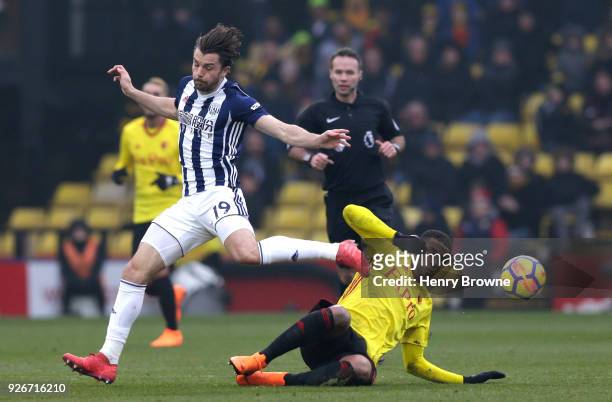 Jay Rodriguez of West Bromwich Albion jumps over Etienne Capoue of Watford during the Premier League match between Watford and West Bromwich Albion...