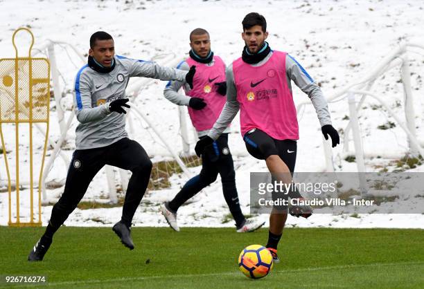 Dalbert Henrique Chagas Estevão and Lisandro Lopez of FC Internazionale compete for the ball during the FC Internazionale training session at the...