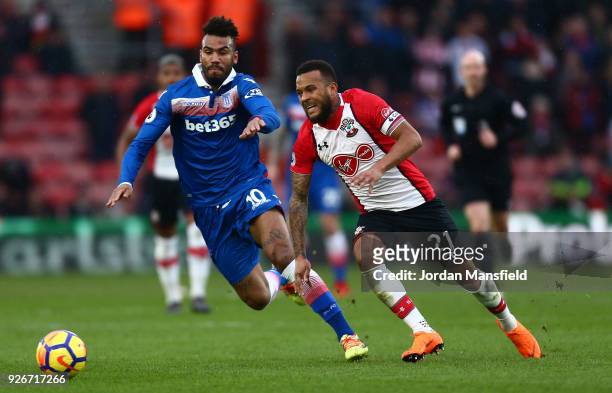 Maxim Choupo-Moting of Stoke City and Ryan Bertrand of Southampton battle for the ball during the Premier League match between Southampton and Stoke...
