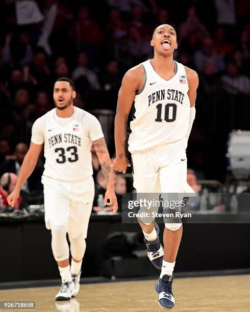 Tony Carr of the Penn State Nittany Lions celebrates giving his team a seven-point lead late in the game against the Northwestern Wildcats during the...