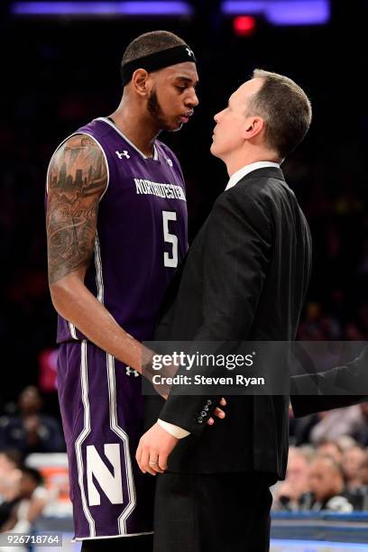 Dererk Pardon and head coach Chris Collins of the Northwestern Wildcats share a moment at the end as he is taken out of the game against the Penn...