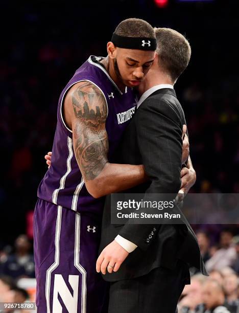 Dererk Pardon and head coach Chris Collins of the Northwestern Wildcats share a moment at the end as he is taken out of the game against the Penn...