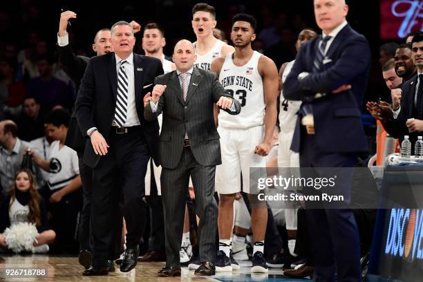 The Penn State Nittany Lions bench reacts against the Northwestern Wildcats during the second round of the Big Ten Basketball Tournament at Madison...