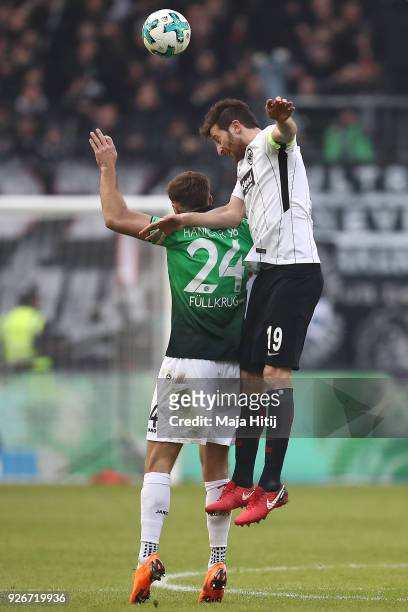 Niclas Fuellkrug of Hannover fights for the ball with David Abraham of Frankfurt during the Bundesliga match between Eintracht Frankfurt and Hannover...