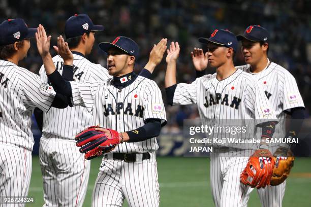 Ryosuke Kikuchi of Japan with teammate celerates after winning during the game one of the baseball international match between Japan And Australia at...