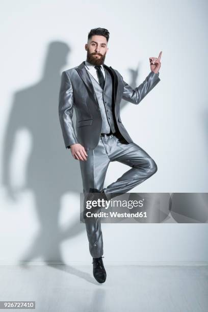 elegant young man jumping and dancing gracefully - hip hopper stock pictures, royalty-free photos & images