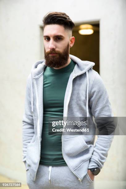 portrait of a young man wearing a track suit - tracksuit stock pictures, royalty-free photos & images
