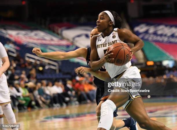 Notre Dame Fighting Irish guard Jackie Young drives to the basket during the ACC women's tournament game between the Virginia Cavaliers and the Notre...