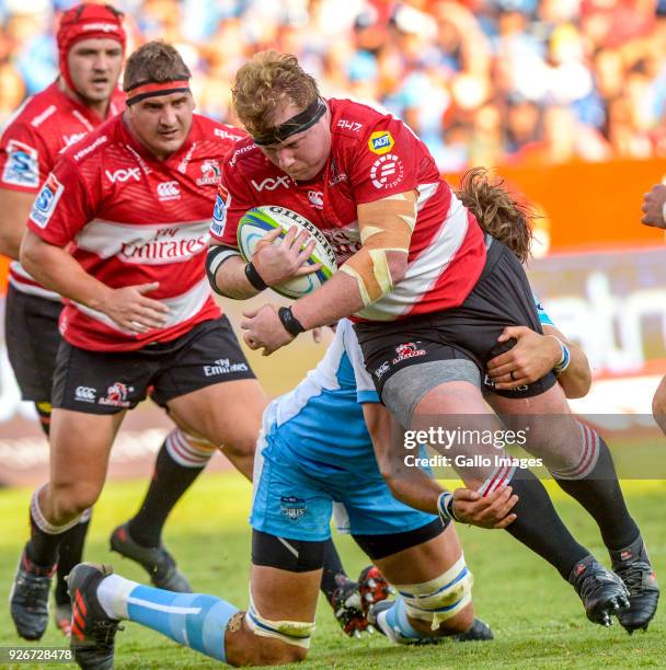 Jacques Van Rooyen of the Lions tackled by Lood de Jager of the Bulls during the Super Rugby match between Vodacom Bulls and Emirates Lions at Loftus...