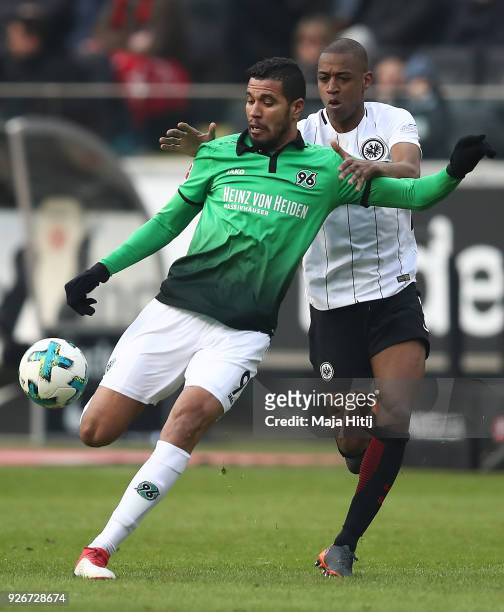 Jonathas of Hannover fights for the ball with Gelson Fernandes of Frankfurt during the Bundesliga match between Eintracht Frankfurt and Hannover 96...