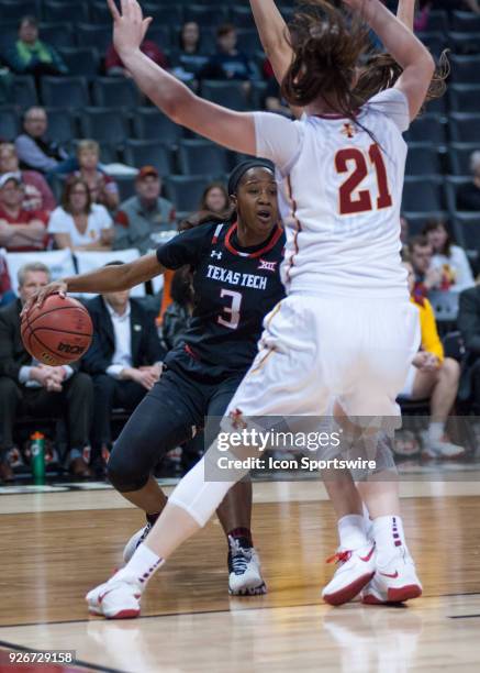 Texas Tech Lyndsay Whilby making a move towards the basket while Iowa State Bridget Carleton plays defense during the Texas Tech Lady Raiders Big 12...