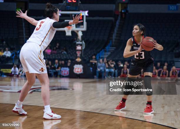 Texas Tech Angel Hayden looking to pass while Iowas State Emily Durr plays defense during the Texas Tech Lady Raiders Big 12 Women's Championship...