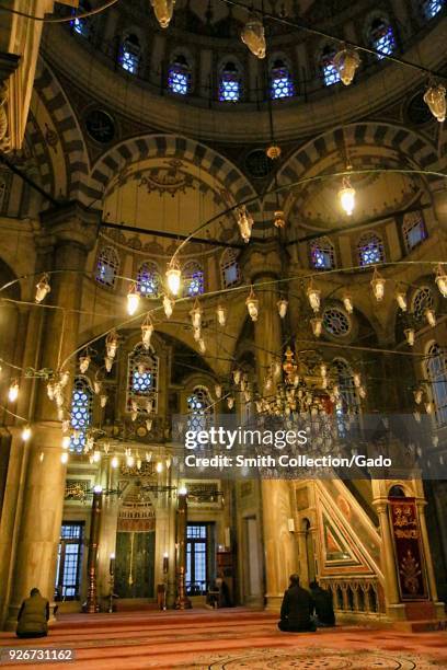 Interior photograph of the dome at Laleli Mosque, illuminated by numerous lights and candles, Istanbul, Turkey, November 22, 2017.