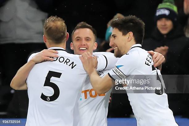 Andy King of Swansea City celebrates his goal with team mate Mike van der Hoorn of and Federico Fernandez during the Premier League match between...