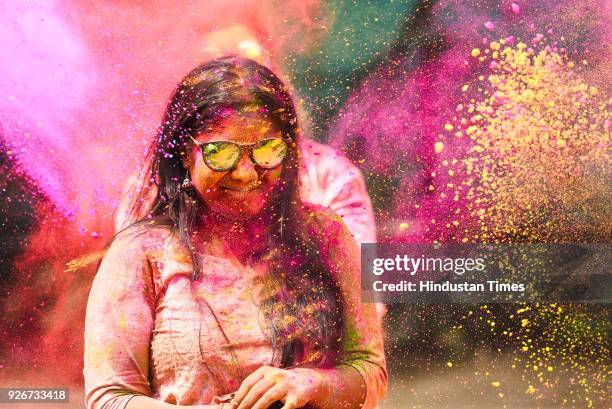 People play with colors as they celebrate festival of Holi at Shivaji Park, Dadar, on March 2, 2018 in Mumbai, India. Holi Festival, also known as...