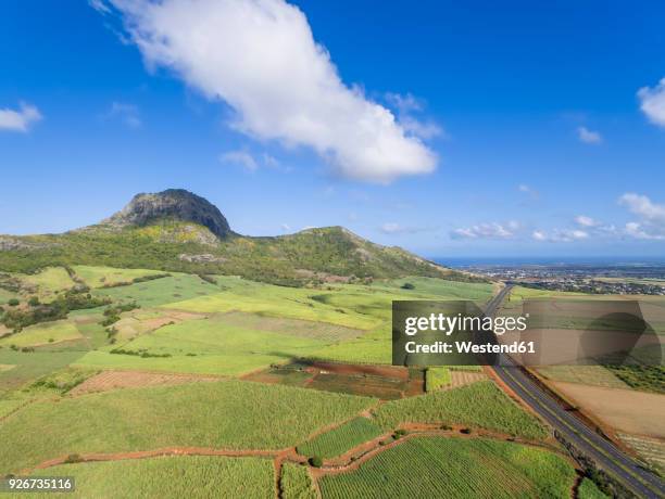 mauritius, highlands, sugarcane fields and terre rouge - terre rouge stock pictures, royalty-free photos & images