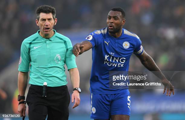 Wes Morgan of Leicester City confronts referee Lee Probert during the Premier League match between Leicester City and AFC Bournemouth at The King...