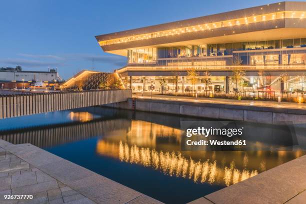 denmark, aarhus, view to lighted dokk1 - aarhus stock pictures, royalty-free photos & images