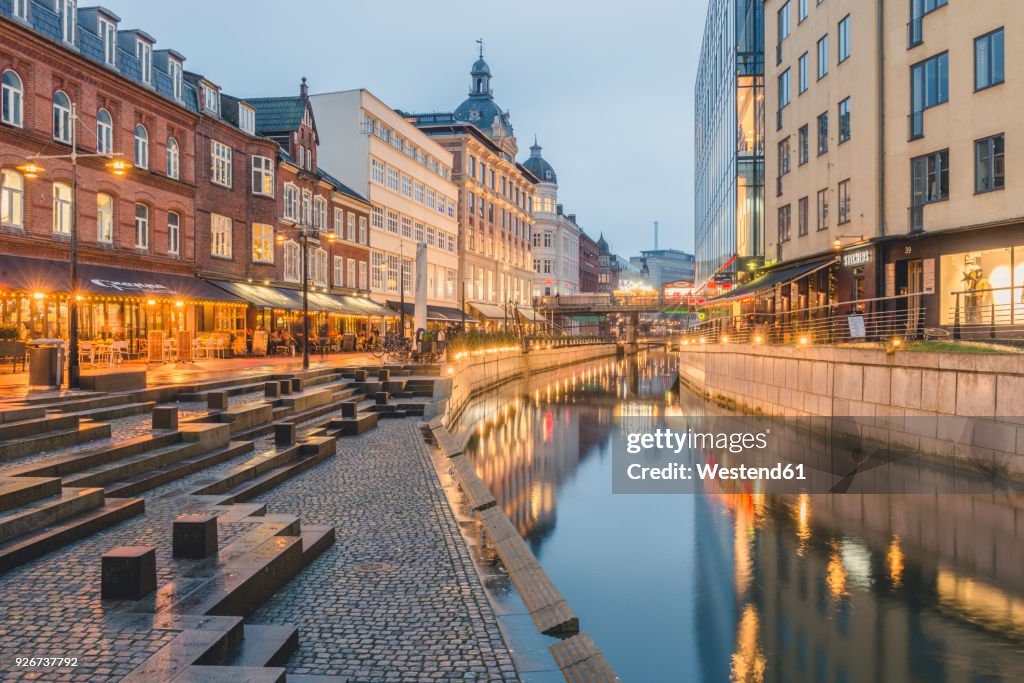Denmark, Aarhus, view to lighted city with Aarhus River