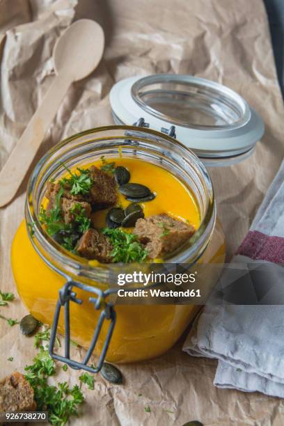 pumpkin soup with croutons, pumpkin seeds, parsley in glass - croûton photos et images de collection